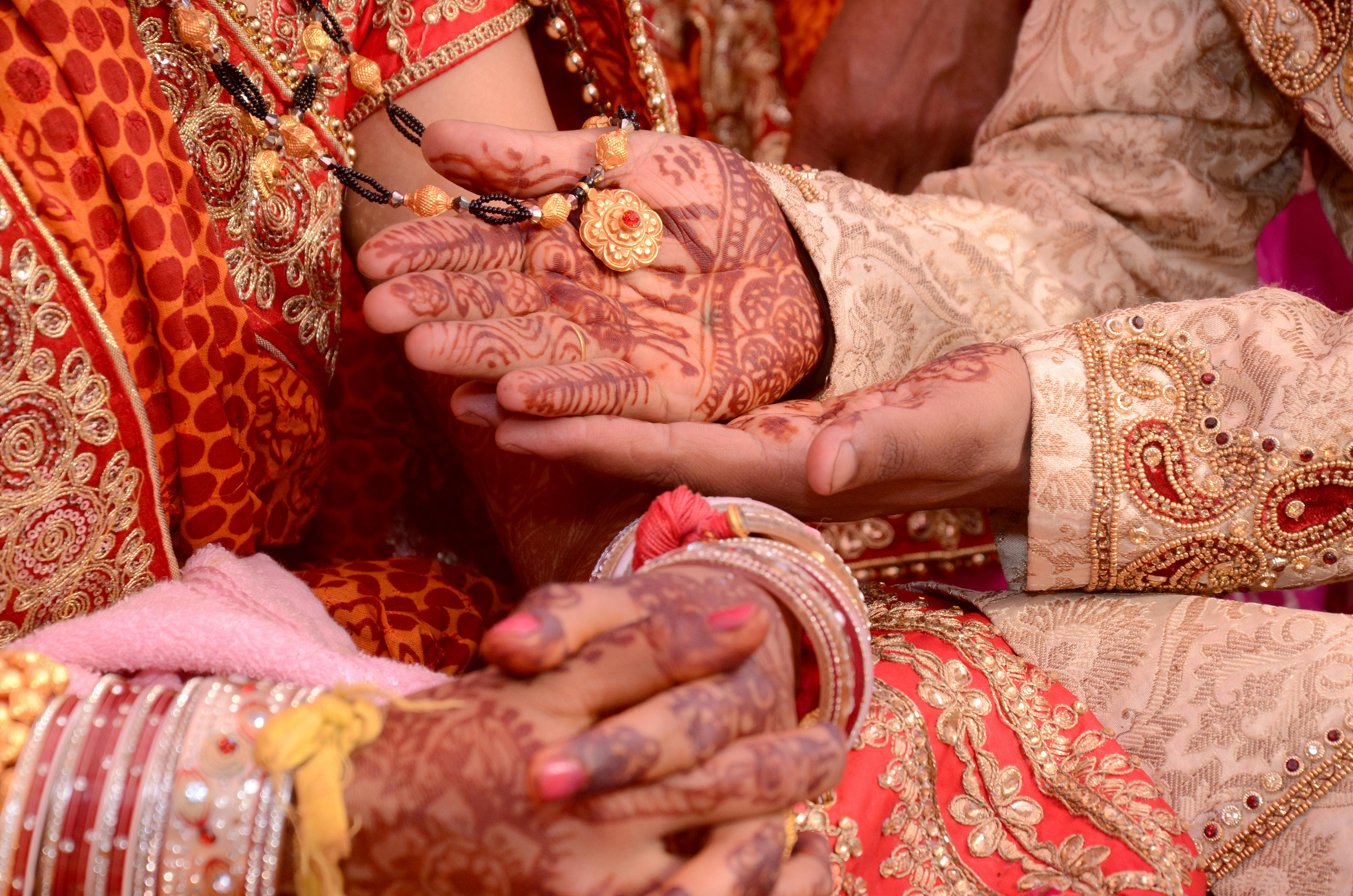 Cupped hands offering a blessing during a wedding ceremony